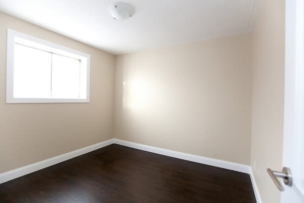 Bedroom with dark plank flooring at 18 Elm Street, Kingston
