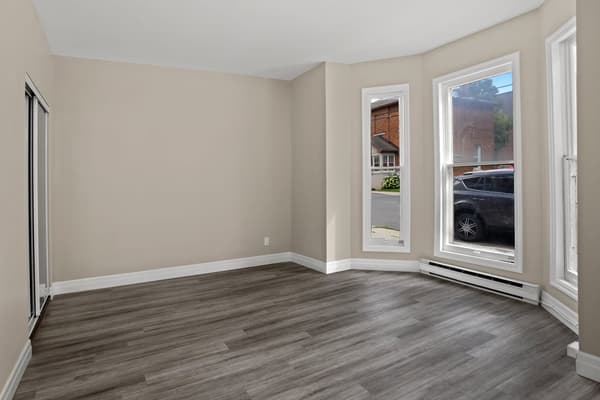 Bay window living room facing the street at 203 Colborne Street, Kingston