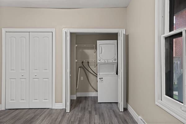 Closet and in-suite stacked washer and dryer at 203 Colborne Street, Kingston