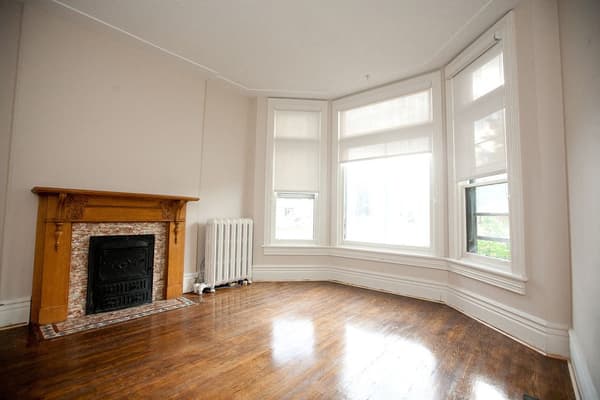 Bay window and original mantel over a cast iron fireplace at 353 Alfred Street, Kingston