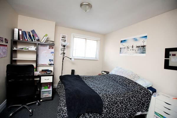 Bedroom with a corner desk and shelving at 353 Alfred Street, Kingston
