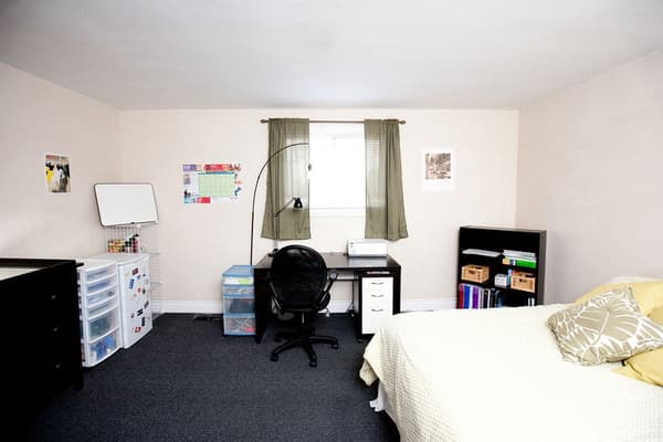 Bedroom with a study desk beneath the window at 353 Alfred Street, Kingston