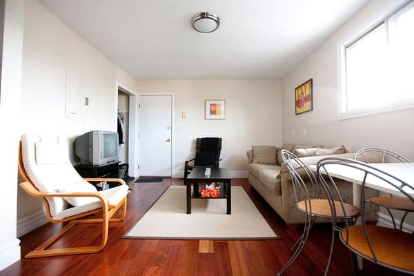 Shared living and dining room with hardwood floors at 353 Alfred Street, Kingston