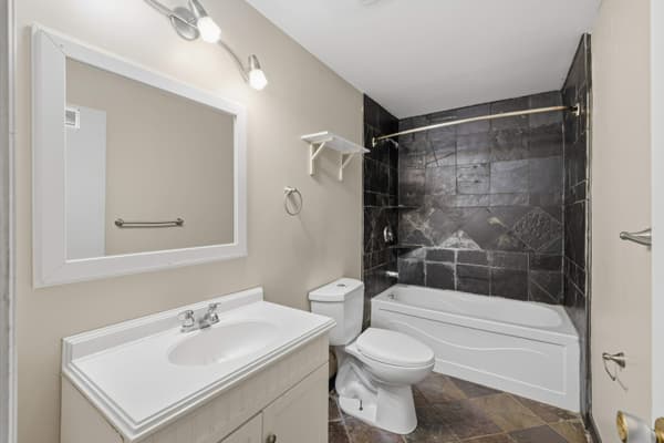 Bathroom with slate tile tub surround at 394 Alfred Street, Kingston