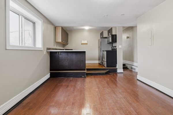 Living area with a kitchen peninsula at 394 Alfred Street, Kingston