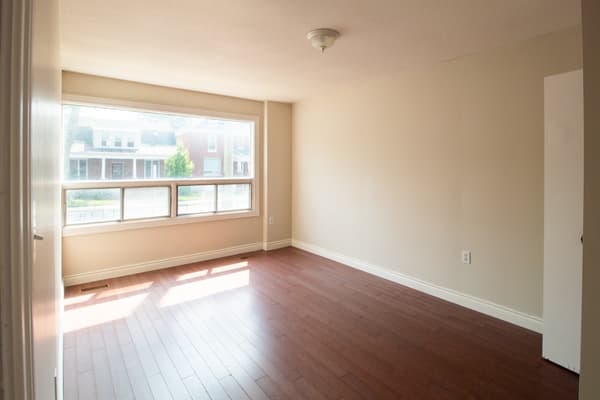 Sunlit living room with picture window at 394 Alfred Street, Kingston