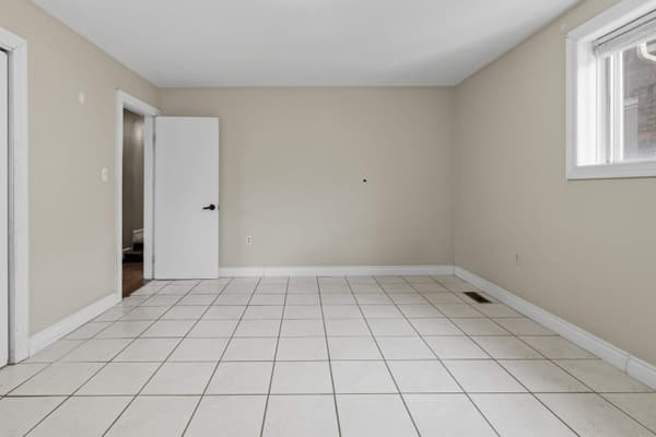 Tiled room with window and closet at 394 Alfred Street, Kingston